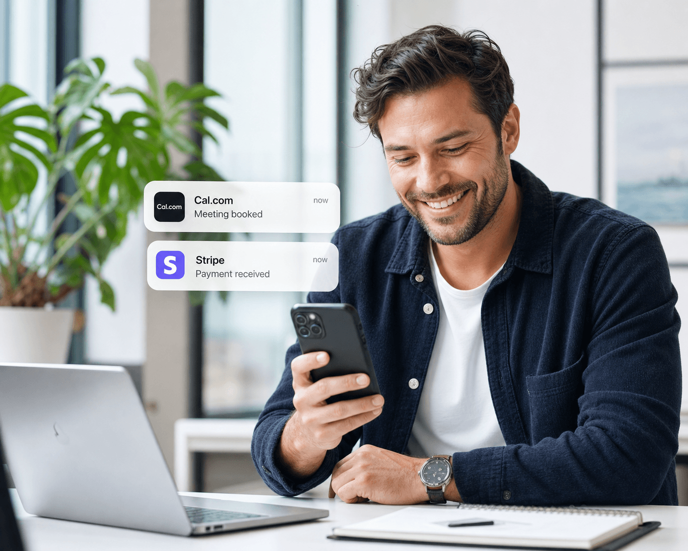 Professional smiling at an iPhone with Cal.com meeting booked and Stripe payment received notification overlays.